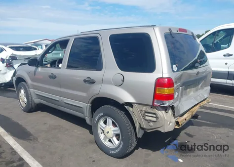 2001 Ford Escape Xls z USA, uszkodzony, nr VIN 1FMYU01141KB90949